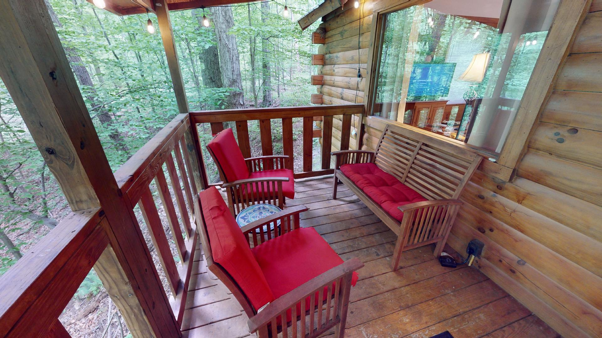 Deck seating beside the hot tub at Aspen Cabin