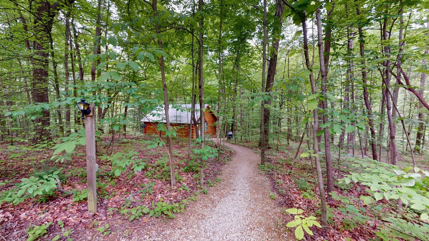 The gravel path through the woods to Aspen Cabin at Bear Run