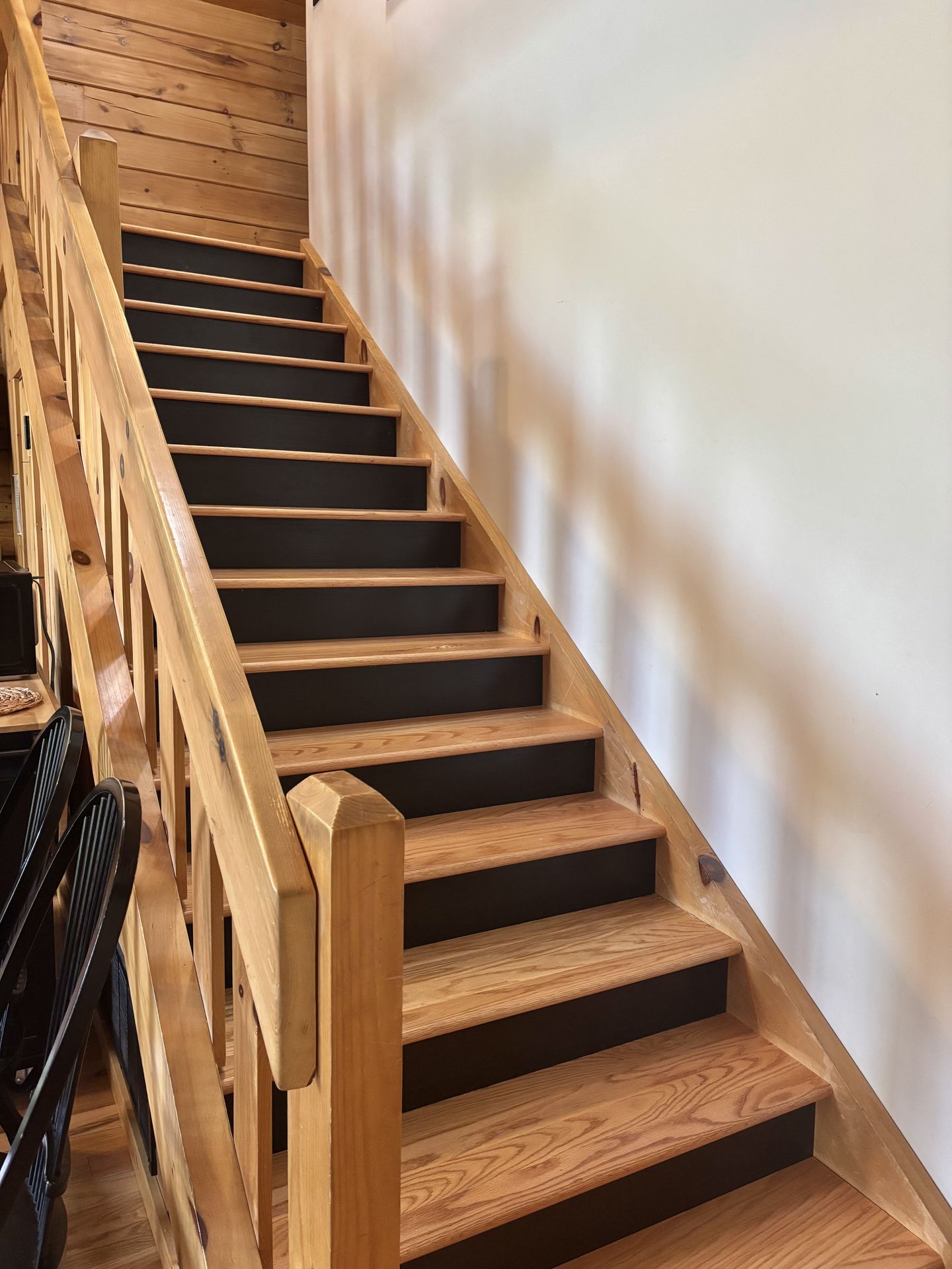 Stairs up to the loft master bedroom at Redbud Cabin